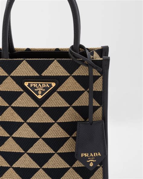 prada women's symbole jacquard fabric bag|Prada Symbole embroidered jacquard fabric travel bag.